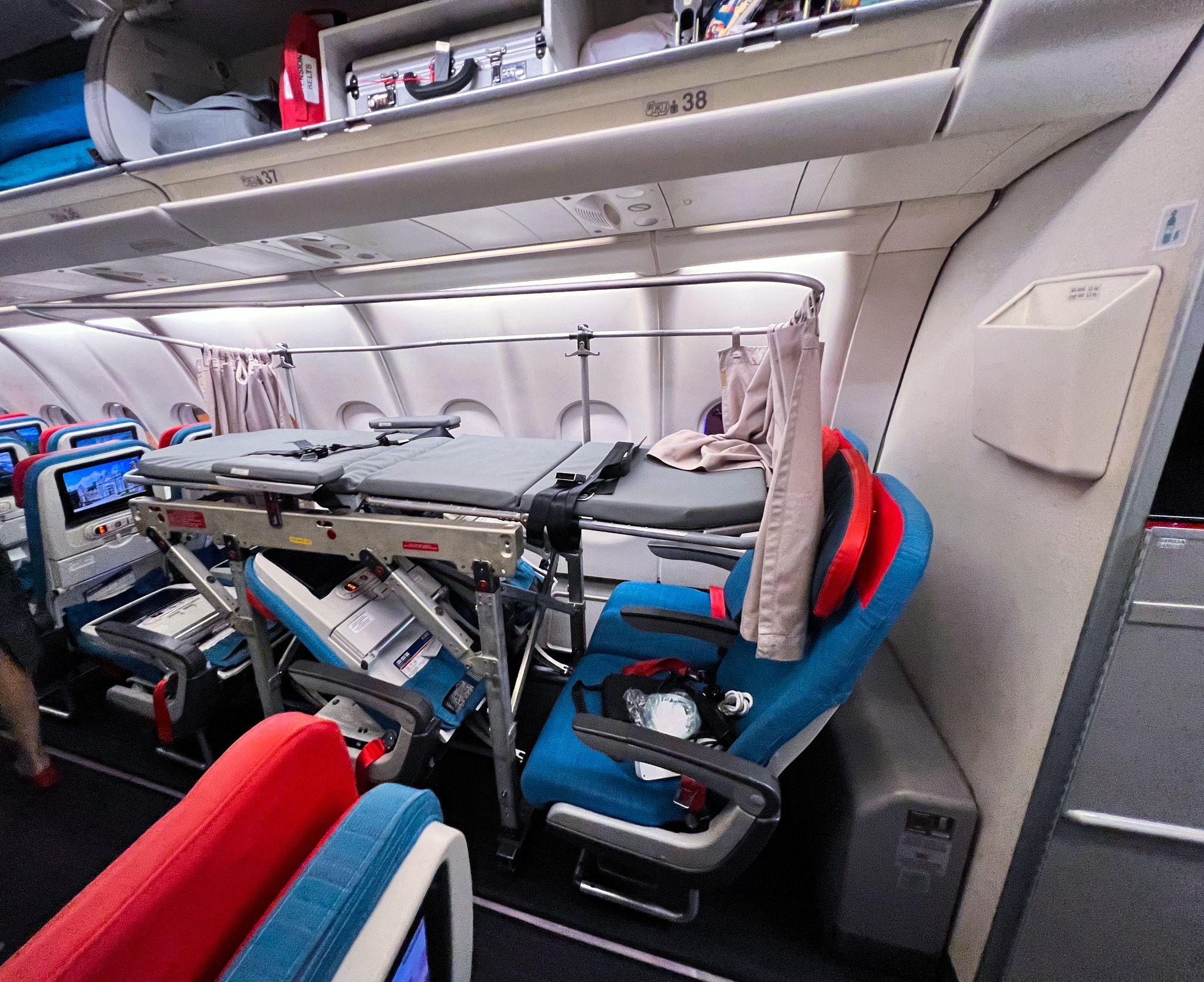 Medical escort assisting a patient on a commercial flight